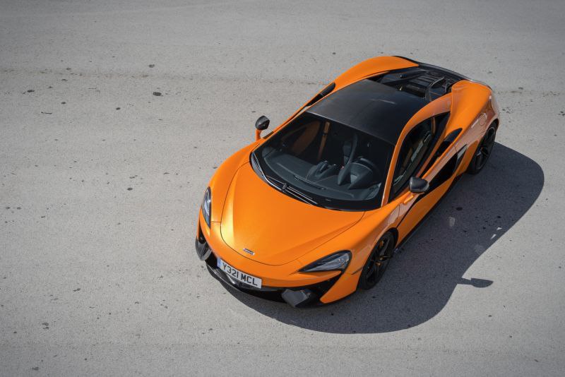 McLaren 570S racer painted in bright orange