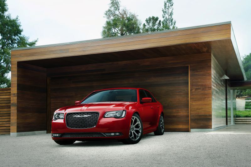 Chrysler 300 - red, in front of  garage